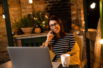 Woman enjoying in her backyard. night scene