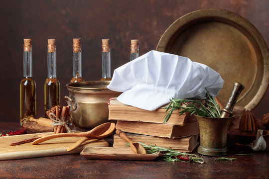 White Chef's Hat And Old Cookbooks.