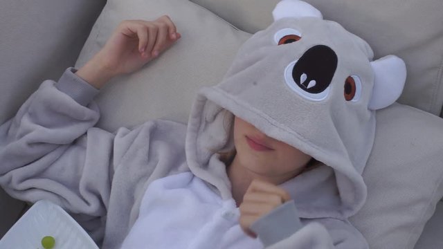 Home education. Quarantine viral infection COVID 19 at school. Self isolation. Social distance. Online education. Girl playing with panda mask.