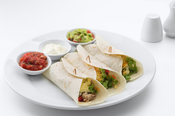 close up view of nice fresh yummy Mexican tacos on white back