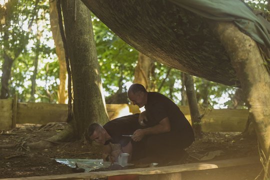Two men looking at map in boot camp