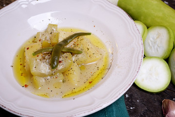 Zucchini dish in broth with potato and onion and herbs  