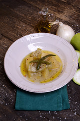 Zucchini dish in broth with potato and onion and herbs  