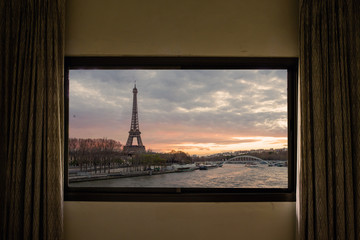Curtain interior decoration in living room, Eiffel as seen through window.