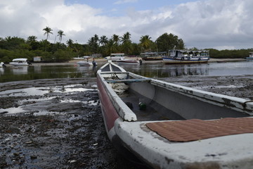 canoe and fishing boat, island of Boipeba, Cairu, Bahia, Brazil