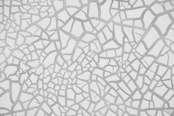 detail of cracked paint on wall. black and white