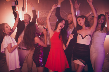 Fancy, luxury drunk people dancing in party club with neon light