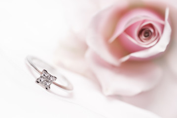 Modern diamond engagement ring (shallow depth of field, bleached)