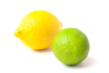 Close up of fresh green lime and lemon isolated on white