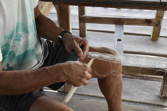 fisherman making his net, Boipeba Island, Cairu, Bahia, Brazil