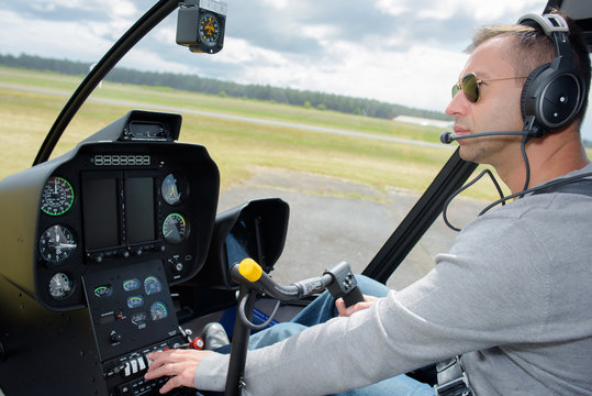 Pilot operating controls in cockpit