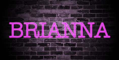 Fototapeta na wymiar first name Brianna in pink neon on brick wall