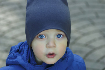 Image of cute baby boy, closeup portrait of adorable child, sweet toddler with blue eyes, healthy childhood, perfect caucasian infant, lovely kid, innocence concept