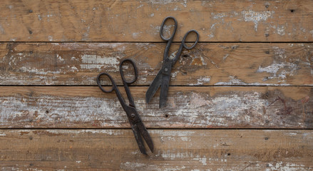 vintage rusty scissors on a wooden table