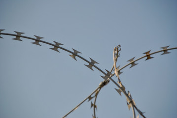 new modern barbed wire against the sky