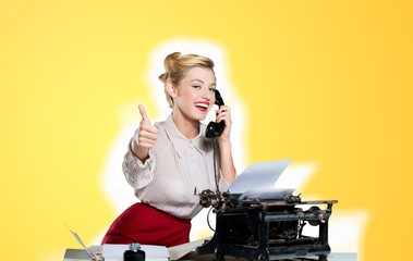 Attractive young woman speaking on  vintage phone