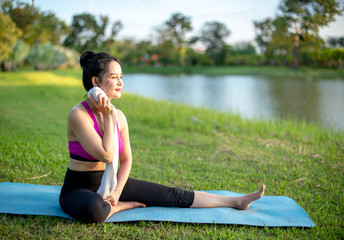 Asian women exercise with YOGA.