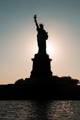 Silhouette of the Statue of Liberty.