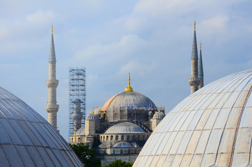 Fototapeta na wymiar Restoration of the Blue Mosque in Istanbul. View between the domes of Hagia Sophia