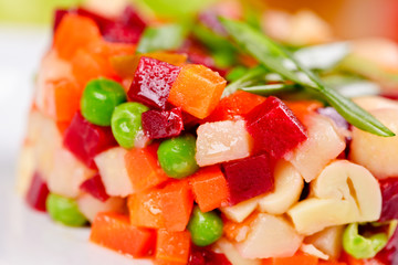 Vinaigrette. Traditional Russian cuisine. Salad with boiled beet root and vegetables on white plate. Close up