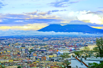 Fototapeta na wymiar View of the city center of Naples and Mount Vesuvius along the Gulf of Naples at sunset in Naples, Italy.