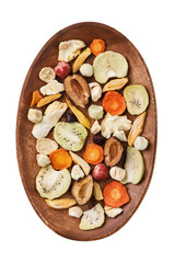 Aerial crispy snack from fruits and vegetables processed by vacuum drying, top view. Food isolated on white background