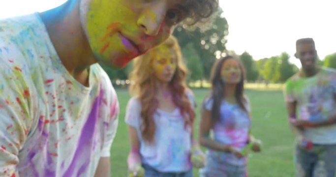 Group of friends playing with holi colors, video concepts about friendship and lifestyle
