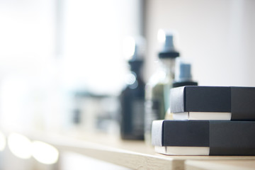 Selective focus of boxes with cosmetic product lying on table in salon