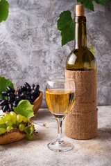 Grape, bottle and glass of white wine 