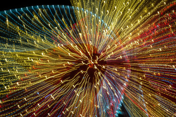 Light painting abstract background. Yellow, red and white light painting, long exposure against a...