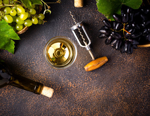 Grape, wine and vintage corkscrew