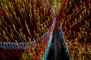 Light painting abstract background. Yellow, red and white light painting, long exposure against a...