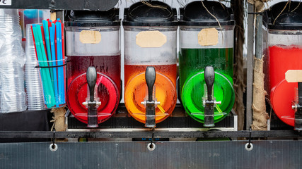 Slush ice drink containers with colorful ice drinks.