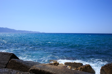 Beautiful blue sea landscape with mauntaints on background.