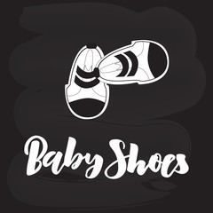 Hand lettering Baby Shoes boutique on chalkboard with sneakers. Modern Calligraphy