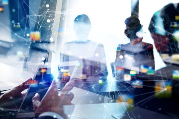 Business people work together in office. Concept of teamwork and partnership. double exposure with...