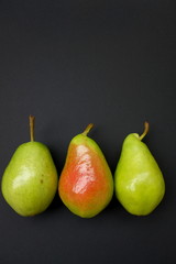 Fototapeta na wymiar pears on black background