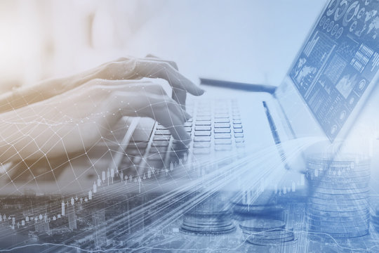 business people hand typing on computer laptop keyboard office lifestyle overlay with city and financial chart.