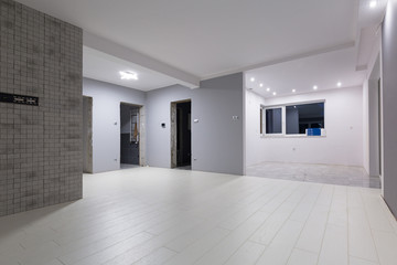 Living room with new laminated floor and decorative wall