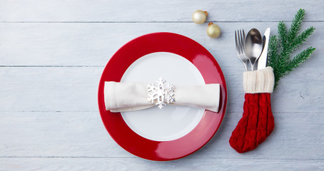 Christmas, New Year celebration place table setting. Wooden background. Copy space. Top view.