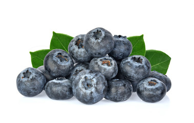Blueberries with green leaves closeup, isolated on white background