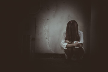 Close up woman wear white shirt in the dark room,Scary movie concept,Horror background,Thailand...