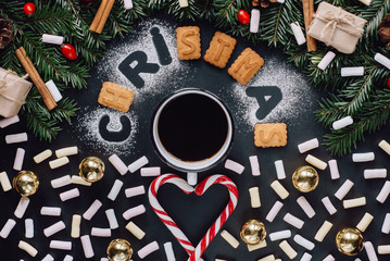 Christmas background with festive decoration, and a cup of coffee on dark background. Winter Flat Lay