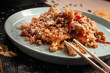 Selective focus on Chinese rice with chicken. Asian fastfood. Chinese cuisine, close up view, top view food, copy space for text.