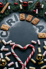 Christmas background with festive decoration on dark background. Winter Flat Lay