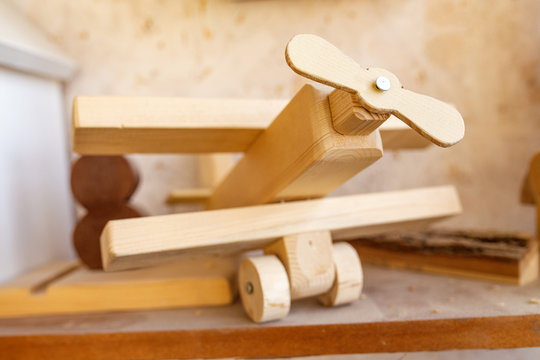 Wooden model of a vintage airplane in carpentry workshop