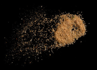 Chilli pepper spices seasoning for soup with vegetables on black background