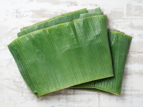 Stack Of Banana Leaf For Wrapping Food On Wood