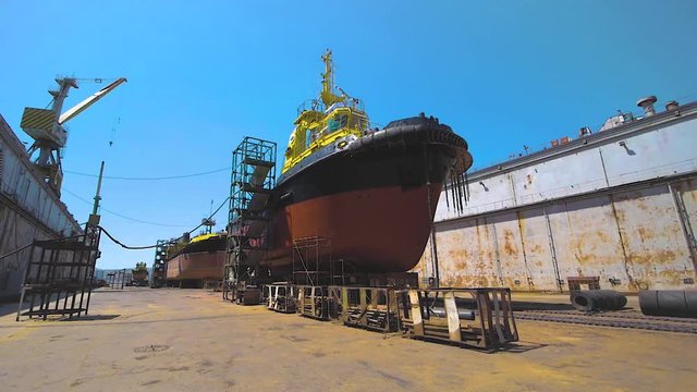 Shipyard. Three Ships in Repair in a Floating Dock. Overhaul and Modernization of Ships