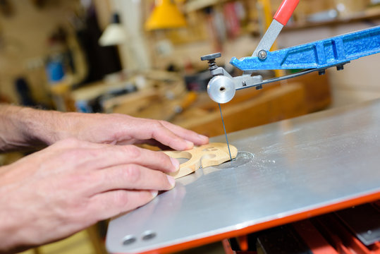 Craftsman cutting wood with fixed blade